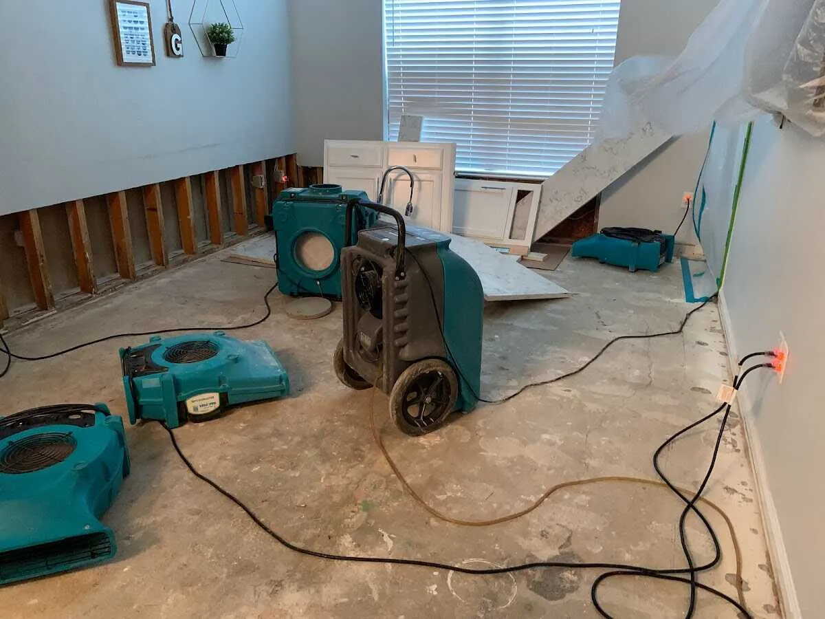 Dehumidifier in flood-cut room for Water Damage Restoration in Altus